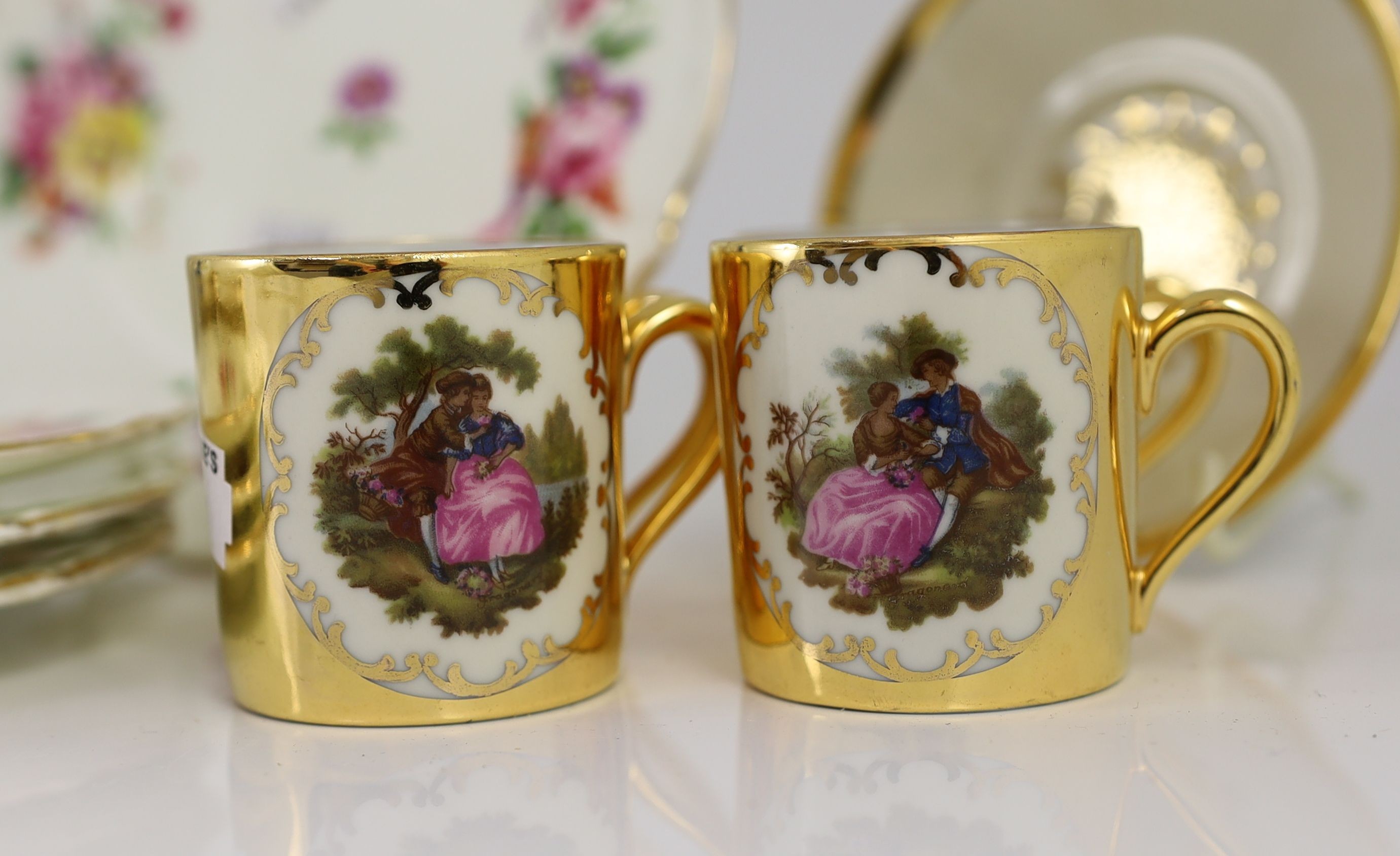 A set of eight German gold ground coffee cans and saucers